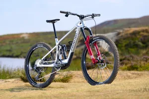 Atherton S.170E.2 three-quarter product view Silver Atherton S.170E.2 electric mountain bike shown in a three-quarter view beside open moorland