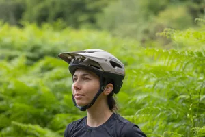 Canyon Deflectr trail helmet review Rider wearing the Canyon ORH01 trail mountain bike helmet in a forest.