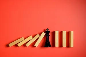 ing chess piece stopping the domino effect concept