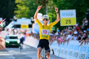 TOPSHOT-CYCLING-SUI-TOUR-MEN UAE Team Emirates - XRG team's Slovenian rider Tadej Pogacar celebrates as he crosses the finish line to win the fifth and final stage of the Men's Tour of Switzerland (Tour de Suisse) cycling race.