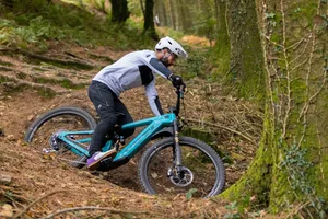 Yeti LTE T4 cornering shot Rob Weaver cornering on the Yeti LTE T4 around a rooty turn.