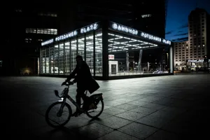 BERLIN, GERMANY – MAY 19: The silhouette of a cyclist is pictured at the Potsdamer Place on May 19, 2021 in Berlin, Germany. (Photo by Florian Gaertner/Photothek via Getty Images)