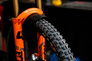 Maxxis Minion DHX tread detail Close-up of a Maxxis Minion DHX front tyre fitted to an orange downhill bike.