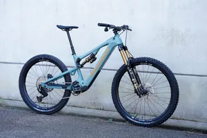 Nukeproof Kilowatt Carbon Factory Nukeproof Kilowatt Carbon Factory electric mountain bike in blue, shown side-on against a concrete wall.