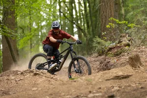 Cannondale Bad Habit ride 3 Riding sliding sideways through a tight, dusty turn in the trail aboard a Cannondale Bad Habit 1 bike.