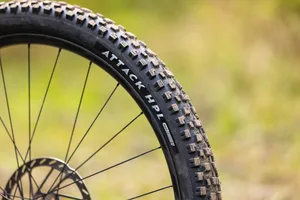 Nutrak/Vee Attack HPL RAD Core tyre Nutrak/Vee Attack HPL mountain bike tyre mounted on a wheel, showing the sidewall logo and tread blocks.