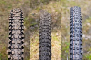 Radial MTB tyre tread comparison Three mountain bike tyre tread patterns shown side by side, comparing Nutrak/Vee, Specialized and Schwalbe radial tyres.