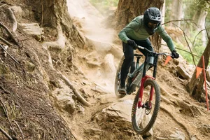 RockShox Boxxer ride shot 2 Rider dropping down over roots and rocks, riding the new RockShox Boxxer.