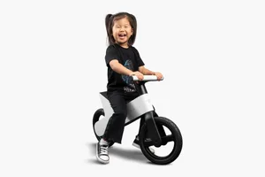 2084866-00-A_1_2000 Girl riding Tesla balance bike.
