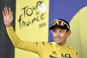 CYCLING-TDF-2026-STAGE 4 Uno-X Mobility team's Norwegian rider Torstein Træen celebrates on the podium with the overall leader's yellow jersey after the 4th stage of the 113th edition of the Tour de France cycling race, 182 km between Carcassonne and Foix in southwestern France, on July 7, 2026. (Photo by Jeff PACHOUD / AFP via Getty Images)