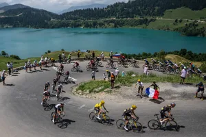110th Tour de France 2023 – Stage 17 COURCHEVEL, FRANCE - JULY 19: (L-R) Jonas Vingegaard of Denmark - Yellow Leader Jersey, Sepp Kuss of The United States and Team, Wout Van Aert of Belgium, Dylan Van Baarle of The Netherlands, Christophe Laporte of France, Nathan Van Hooydonck of Belgium and Team Jumbo-Visma and a general view of the peloton passing close to the Roselend Dam (1971m) during the stage seventeen of the 110th Tour de France 2023 a 165.7km at stage from Saint-Gervais Mont-Blanc to Courchevel / #UCIWT / on July 19, 2023 in Courchevel, France. (Photo by David Ramos/Getty Images)