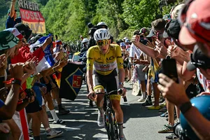 TOPSHOT-CYCLING-TDF-2026-STAGE 19 TOPSHOT - UAE Team Emirates - XRG's Slovenian rider Tadej Pogacar wearing the overall leader's yellow jersey chases down the lead breakaway group in the Alpe d'Huez ascent during the 19th stage of the 113th edition of the Tour de France cycling race, 127,9 km between Gap and Alpe d'Huez in the French Alps, on July 24, 2026. (Photo by Loic VENANCE / AFP via Getty Images)