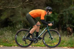 Condor Italia RC Disc – 05 Male cyclist in orange top riding the Condor Italia RC Disc road bike