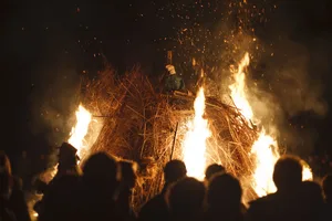 People around bonfire on Guy Fawkes night, UK A group of people stood around a bonfire