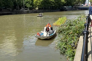 Boat Two men on a boat going through Bristol harbour