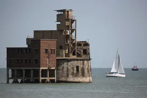Views Of The Isle Of Grain A sailing boat makes its way past Grain Tower, a mid-19th-century gun tower on the Isle of Grain