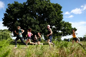 Parkrun Celebrates Millionth Event HAMPTON, ENGLAND - JUNE 13: Participants run during the parkrun event at Bushy Park on June 13, 2026 in Hampton, England. Parkrun celebrated the incredible milestone of its one millionth event this weekend, calling on the parkrun community to power the next million via donations. At Bushy parkrun, founder Paul Sinton-Hewitt and CEO Lil Duggan were joined by parkrun-loving Olympian Dame Kelly Holmes to celebrate the milestone with parkrunners. (Photo by Peter Nicholls/Getty Images for parkrun)