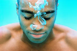 Holding breath Man holding breath underwater
