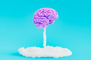 creativity explosion concept Brain taking off from the ground with a cloud of smoke underneath.