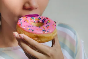 eating donut Person eating donut