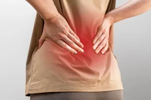 back pain Person holding back in pain.