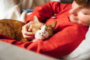 Cat snuggles A woman snuggling a cat