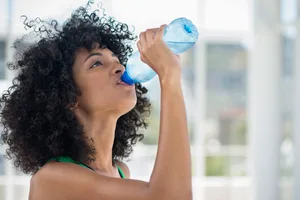 Woman drinking water bottle Woman drinking water bottle