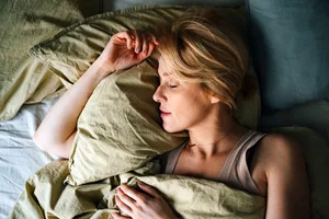 Woman sleeping in bed. Woman sleeping in bed.
