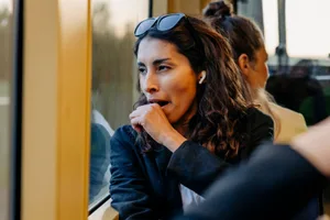 Yawning A woman yawns on public transport