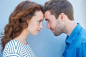 men-v-women-confidence Close up of couple forehead to forehead