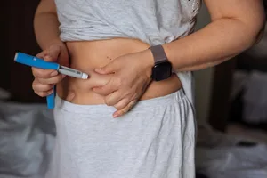glp1s Person injecting GLP-1 drug