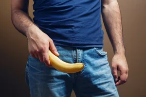 man-holding-banana (1) Man holding a banana near his crotch