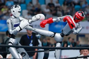 Boxing Robots A robot kicks another robot during a kickboxing match at the World Humanoid Robot Games