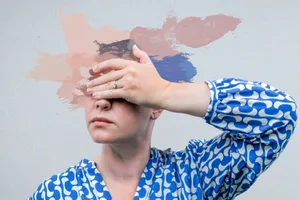 woman menopause woman who has smudged her face into oil paint