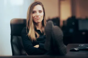 boss Female boss with legs on table