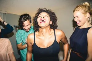 how-to-be-more-attractive Photo of a group of people enjoying a house party
