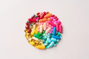 Why your supplements aren’t working Colourful tablets/supplements are arranged in the shape of a circle.