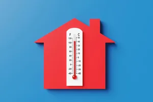 This hack keeps your home cooler in a heatwave A white thermometer is on top of a red house shape against a blue background