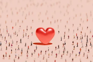 A large heart in the centre of a crowd of people A large heart in the centre of a crowd of people