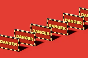signs of mould exposure A digitally-generated image of multiple signs that read 'DANGER' arranged in a diagonal line against a red background
