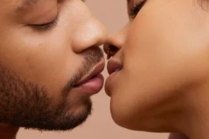 Studio portrait of kissing couple Studio portrait of kissing couple