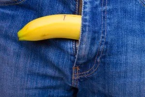 Erectile dysfunction A banana pokes out of the zipper of a pair of jeans