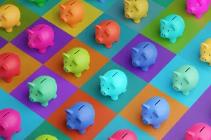 Colourful piggybanks are arranged on a colourful checkerboard Colourful piggybanks are arranged on a colourful checkerboard