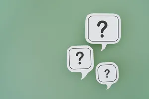 Questions that reveal who you really are Question marks on different-sized speech bubbles on a green background