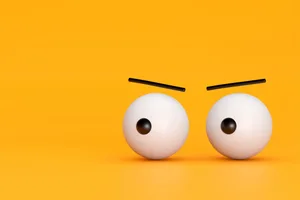 Signs someone is jealous of you Two eyes on a yellow background