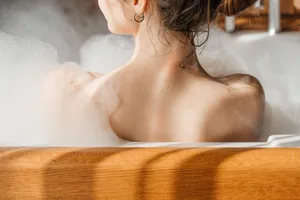 A woman relaxing in a bubble bath A woman relaxing in a bubble bath