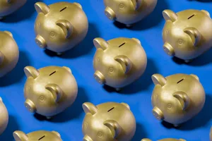 Easy ways to save money Gold piggy banks on a blue background