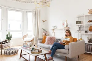 Home makeover: ‘Our flat has bags of character!’ Kate’s mid-century-inspired living room has a pale colour scheme that lets the feature furniture stand out. Most of the furniture in here is from West Elm, including the sofa, chair, coffee table and cushions