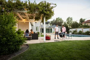 pagoda Wide view of friends enjoying party at vacation rental