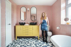 Karen and Joe hired a builder to convert a spare bedroom into their colourful en-suite. Their builder put in all the pipework and electrics, while the couple took on the finishing touches themselves, like upcycling the bright yellow vanity unit 'We turned a bedroom into our colourful en-suite'